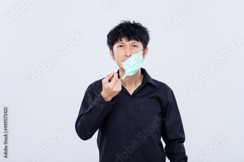 Asian men wear masks to prevent PM.5 dust and The coronavirus epidemic is spreading isolated white background.
