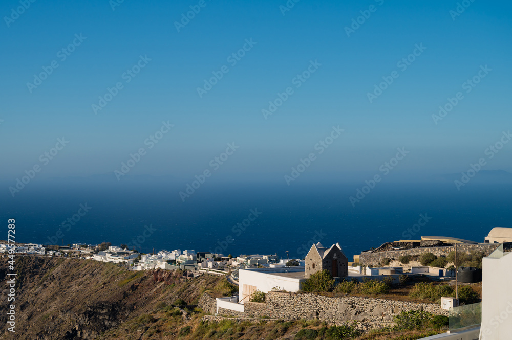White architecture of Imerovigli on Santorini island, Greece. View of Aegean sea and caldera.