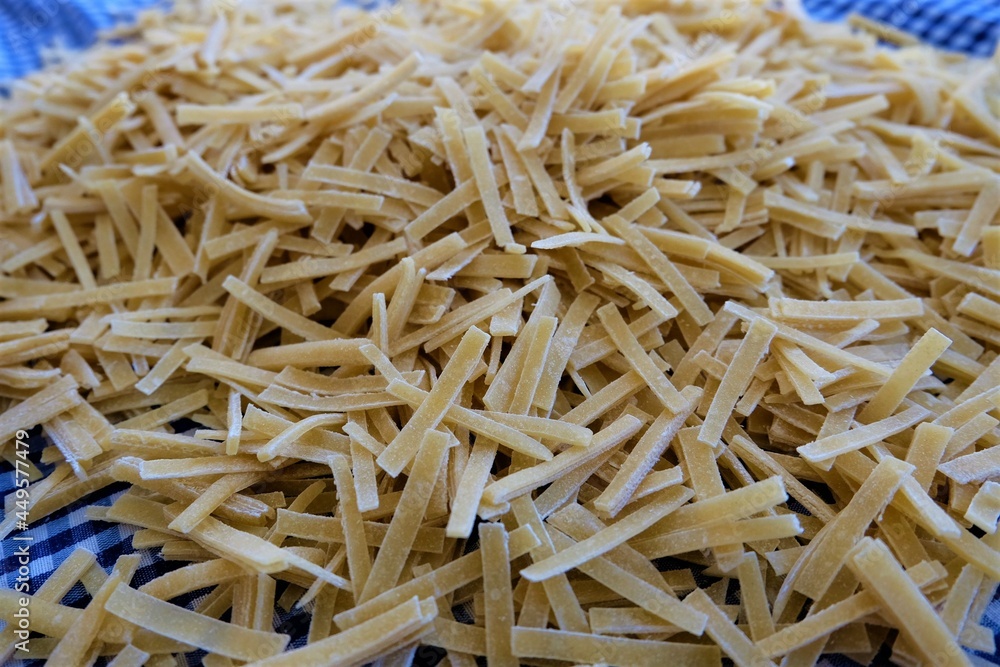 Preparing process of homemade Turkish noodle, selective focus. Noodles are the pasta that Turkish women make. It is called Preparing process of homemade Turkish noodle, selective focus. Noodles are the pasta that Turkish women make. It is called
