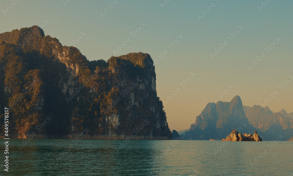 Cheow Lan lake in Khao Sok National Park, Thailand. Tropical landscape at the dawn postcard poster wallpaper