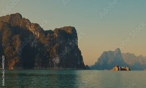 Cheow Lan lake in Khao Sok National Park, Thailand. Tropical landscape at the dawn postcard poster wallpaper © Darya Lavinskaya