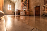 interior of a church in Rome. Roman catholic church interior illuminated by the afternoon golden light. 