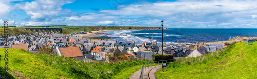 A view leading down to the lower part of the town of  Cullen, Scotland on a summers day