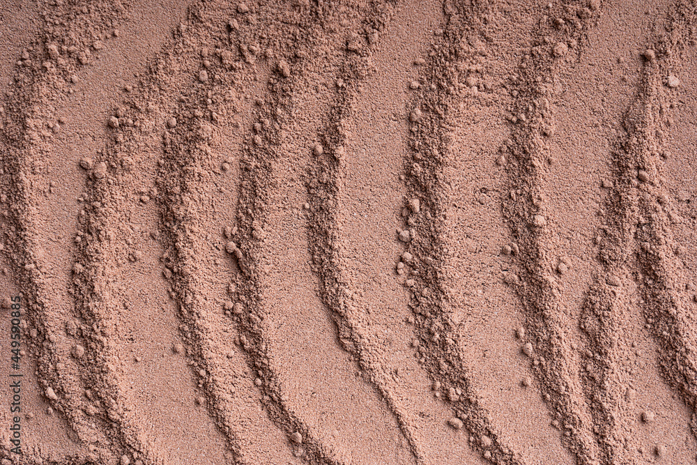 Background or backdrop of brown sweet cocoa powder texture with lines pattern made from dried beans used in drink preparation, also in bakery and culinary contains flavonoids. Horizontal, copy space Background or backdrop of brown sweet cocoa powder texture with lines pattern made from dried beans used in drink preparation, also in bakery and culinary contains flavonoids. Horizontal, copy space