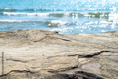 Sticker Empty cliff stone with summer blue sea blur background