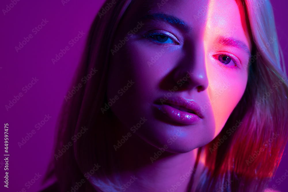 Portrait with neon-style lighting, a young beautiful blonde Portrait with neon-style lighting, a young beautiful blonde