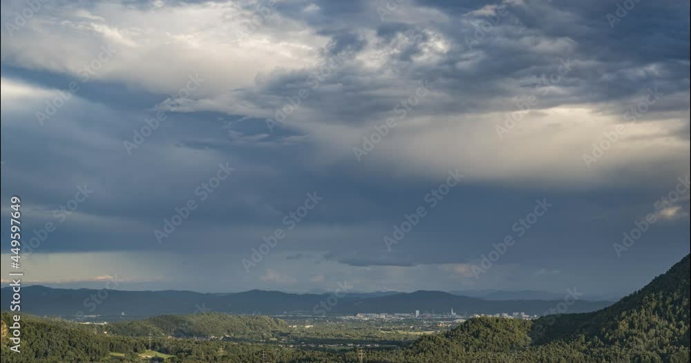 Time lapse of storm moving over mountains and hills in Slovenia. Ljubljana city in the foreground. Summer downpour in the distance. Static shot Time lapse of storm moving over mountains and hills in Slovenia. Ljubljana city in the foreground. Summer downpour in the distance. Static shot