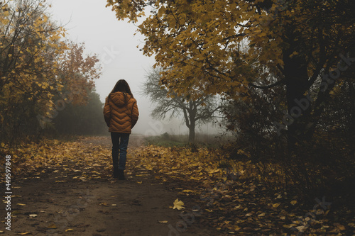 Children walk in the autumn park