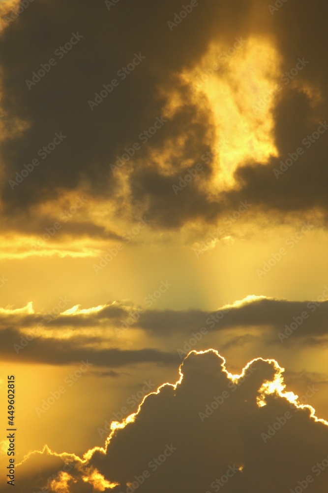 Beautiful sunset with dark clouds and sunbeam Beautiful sunset with dark clouds and sunbeam