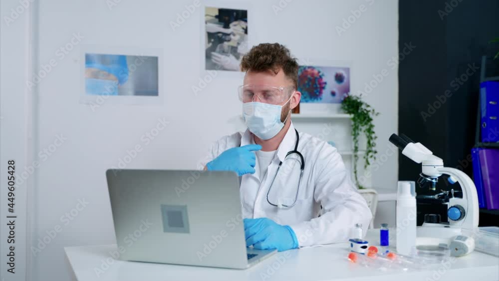 physician appointment by video call at virus outbreak, male doctor is communicating with patient by laptop physician appointment by video call at virus outbreak, male doctor is communicating with patient by laptop