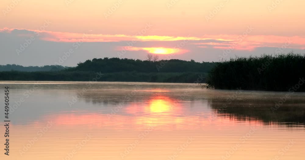 Time lapse golden light sunrise in morning. Big sun with clouds sunset timelapse. Amazing light of nature near river or lake. Landscape Time lapse golden light sunrise in morning. Big sun with clouds sunset timelapse. Amazing light of nature near river or lake. Landscape