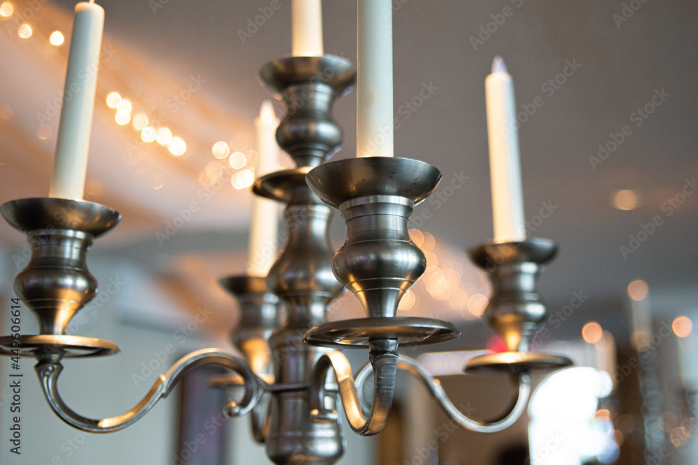 Fototapeta premium Decorative Brass candle lamp hanging from ceiling