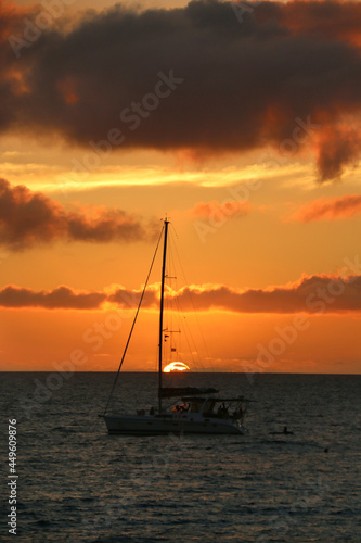 boat at sunset on water in fiji © Geoff