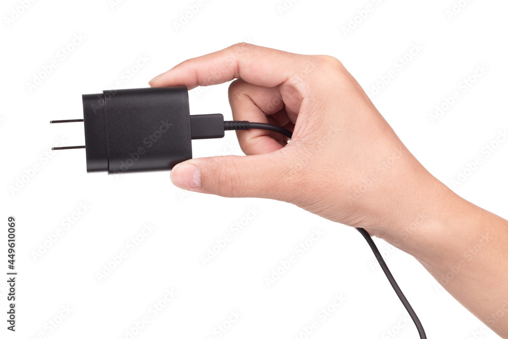 hand holding Mobile phone charger isolated on a white background.