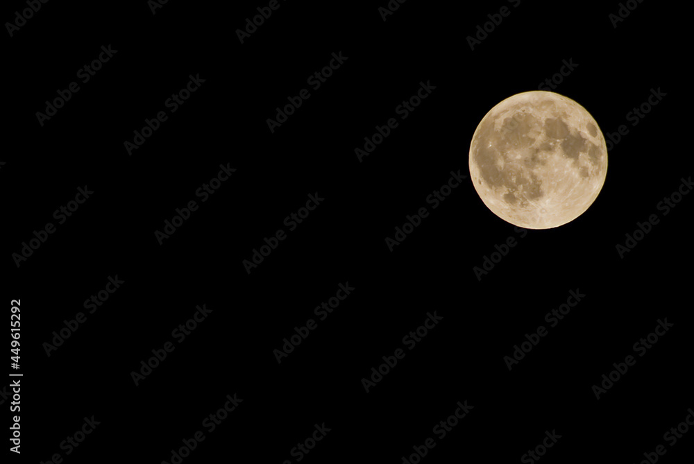 Full moon in August in Colorado, against a black background Full moon in August in Colorado, against a black background