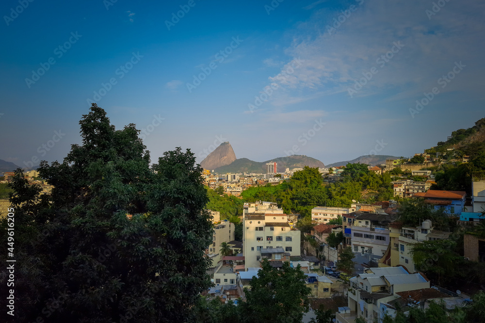 View of the Santa Tereza neighborhood in Rio de Janeiro with the Sugarloaf Mountain in the background.