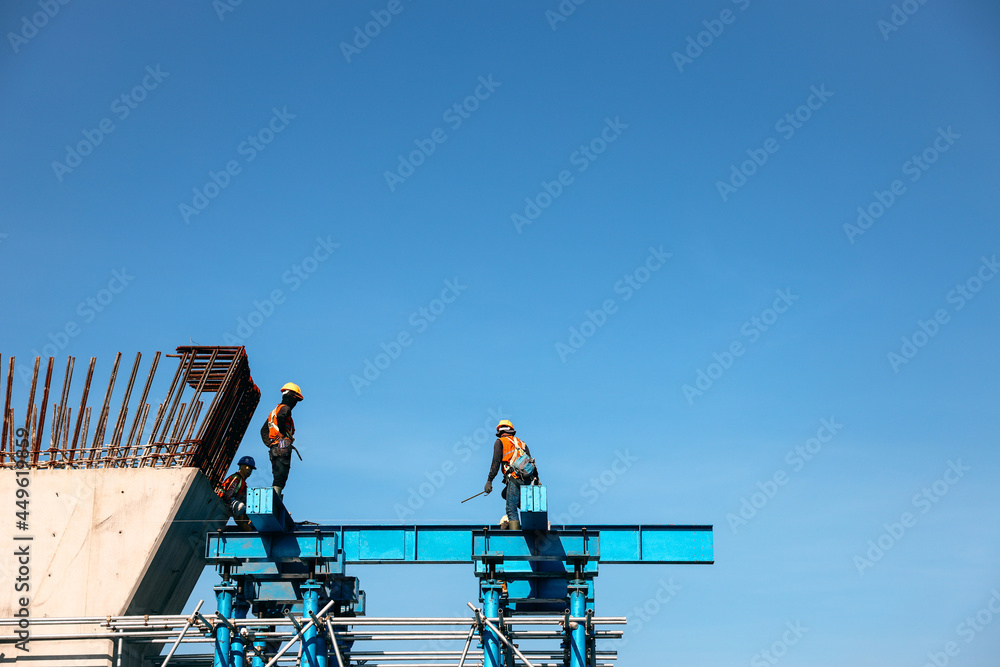 Naklejka premium Group of workers working at a construction site