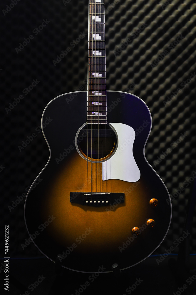 guitar standing on studio background