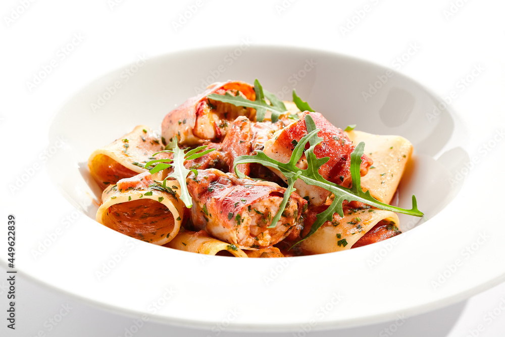 Tuna Cannelloni pasta - noodles plate with tuna fish meat. Pasta dish with tuna, tomato sauce and rocket salad. Restaurant gourmet cannelloni pasta food plate isolated on white background.. Tuna Cannelloni pasta - noodles plate with tuna fish meat. Pasta dish with tuna, tomato sauce and rocket salad. Restaurant gourmet cannelloni pasta food plate isolated on white background..
