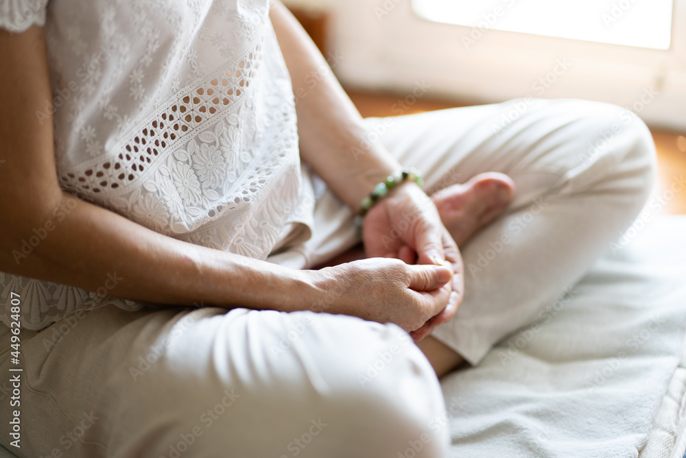 senior woman doing meditation at home. mindfulness concept senior woman doing meditation at home. mindfulness concept