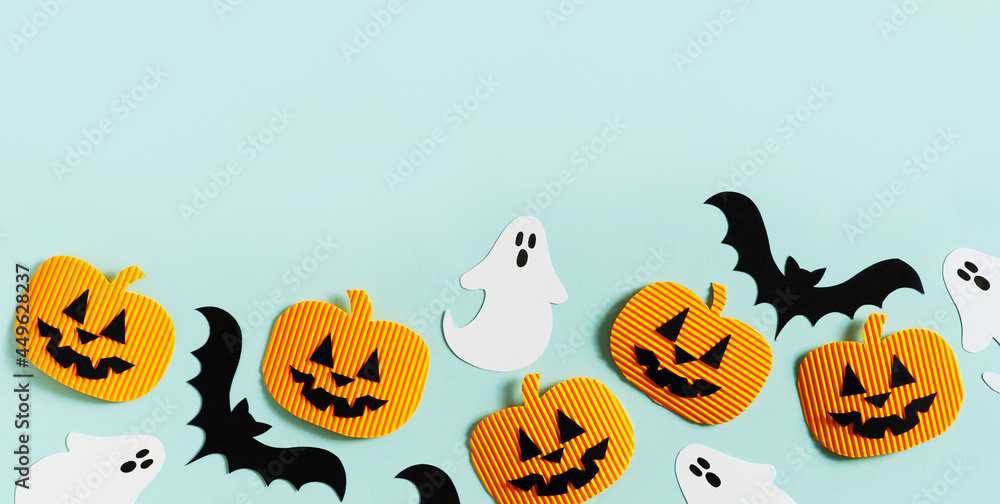Halloween party concept with fun paper decor, pumpkins, ghost Halloween party concept with fun paper decor, pumpkins, ghost