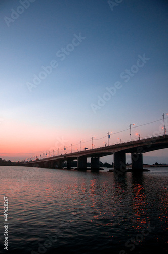 bridge over the river with sunset background © nk