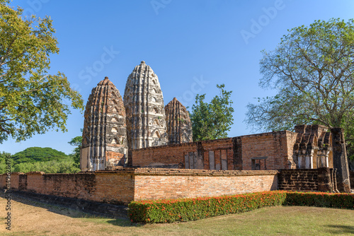 View of the ruins on the ancient Buddhist temple Wat Sri Sawai in the historical park of the Sukhothai city. Thailand photo