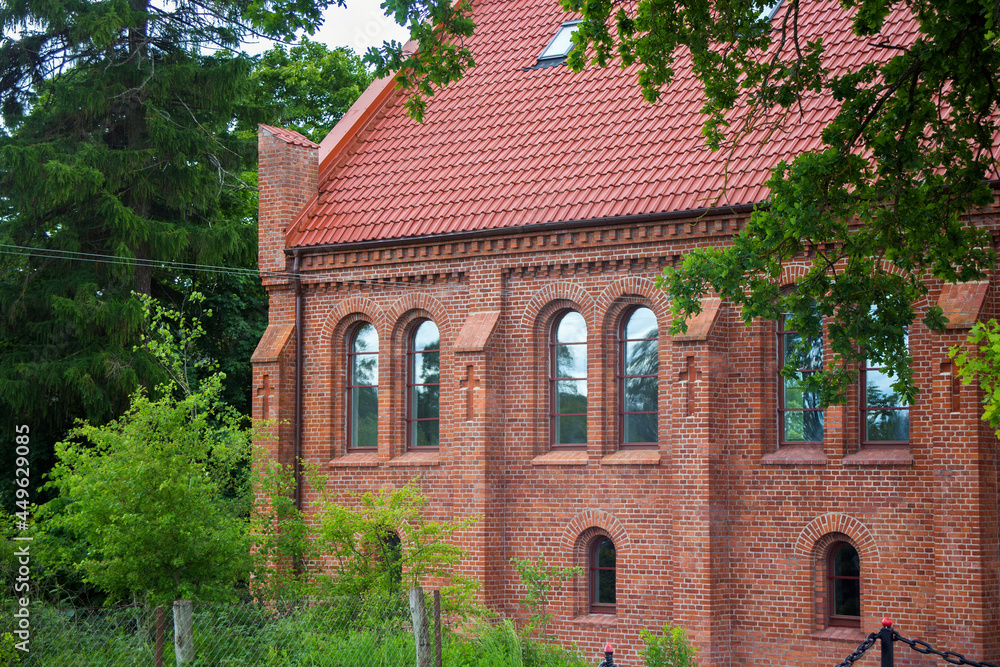 Old red bricks church in Krasnolesye village (former Gross Rominten) of Kaliningrad Oblast, Russia. Now is the russian orthodox church of Holy Martyrs Adrian and Natalia. Old red bricks church in Krasnolesye village (former Gross Rominten) of Kaliningrad Oblast, Russia. Now is the russian orthodox church of Holy Martyrs Adrian and Natalia.