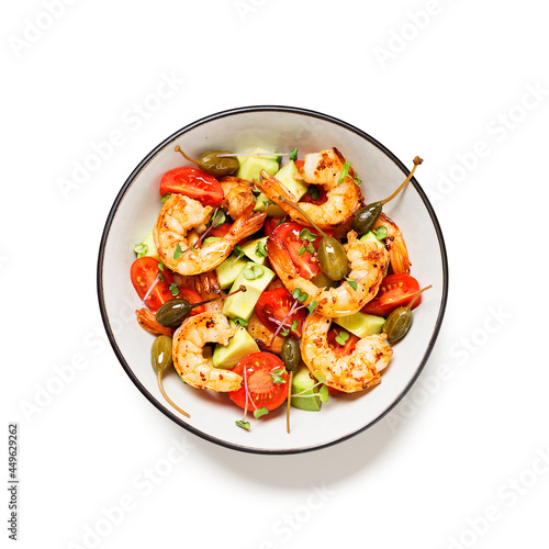 Easy grilled shrimp avocado salad with cherry tomatoes, capers and microgreens. Isolated on white background. Top view. 