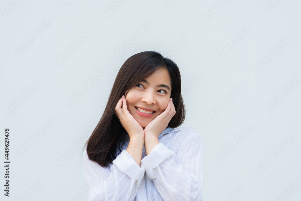 close up attractive adult business woman asian girl with happy and smile against white concrete wall office. close up attractive adult business woman asian girl with happy and smile against white concrete wall office.