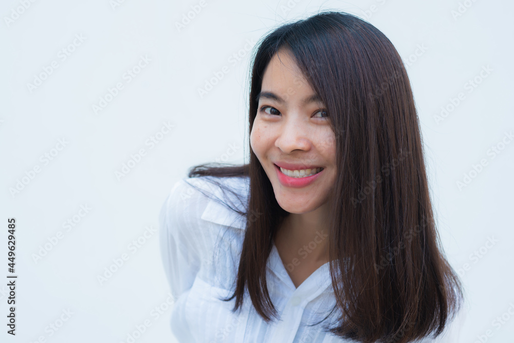 close up attractive adult business woman asian girl with happy and smile against white concrete wall office. close up attractive adult business woman asian girl with happy and smile against white concrete wall office.