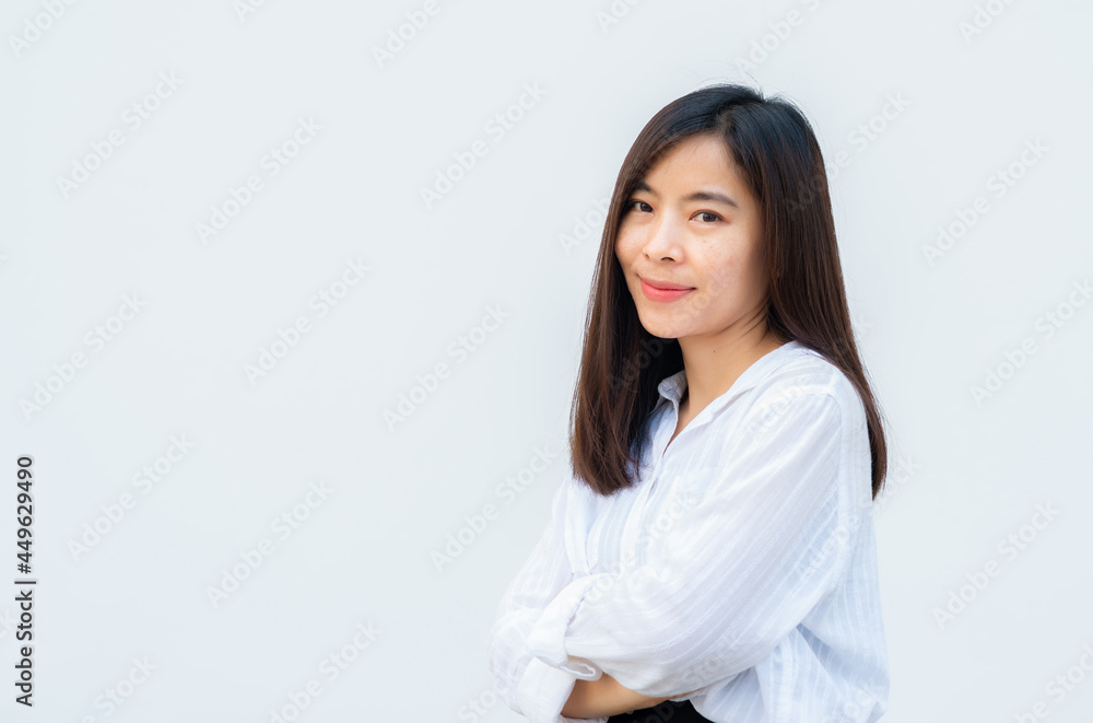 close up attractive adult business woman asian girl with happy and smile against white concrete wall office. close up attractive adult business woman asian girl with happy and smile against white concrete wall office.