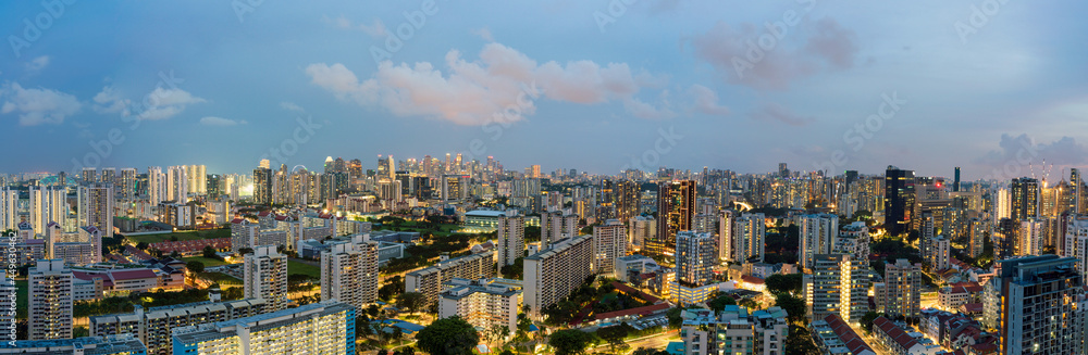 Ultra wide panorama image of Singapore skyscrapers at magic hour.