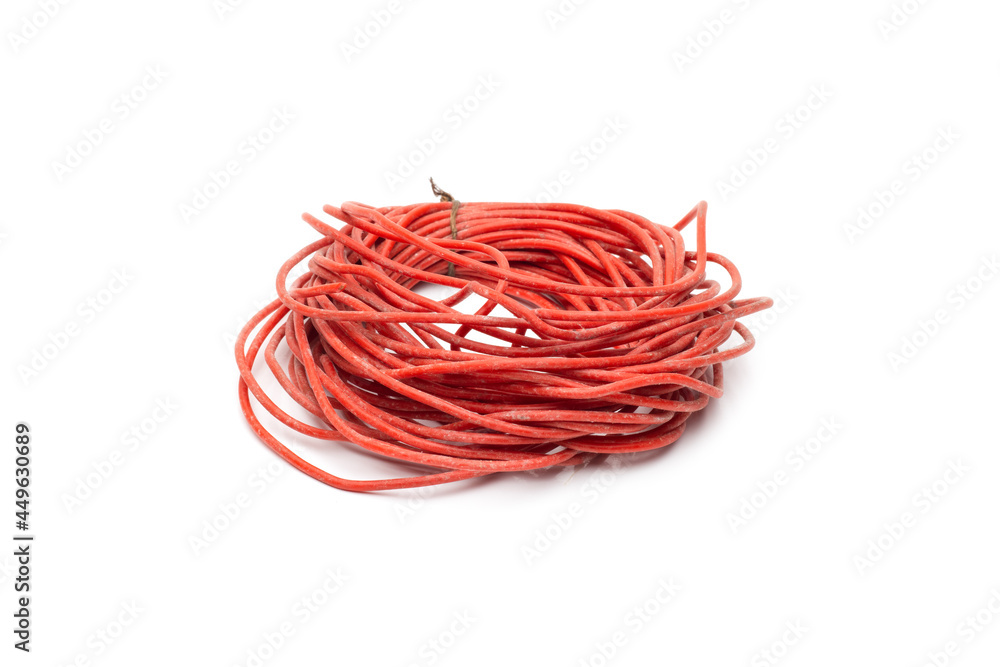 Heap of old dusty red electricity wire with selective focus on isolated white background Heap of old dusty red electricity wire with selective focus on isolated white background
