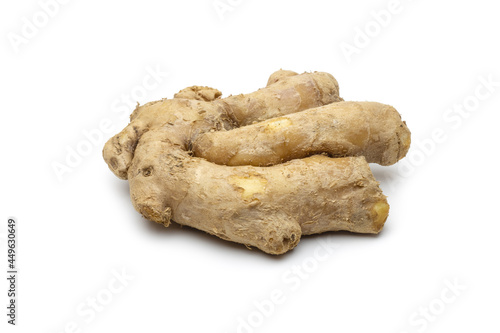 Fresh and organic dried ginger on isolated white background with selective focus
