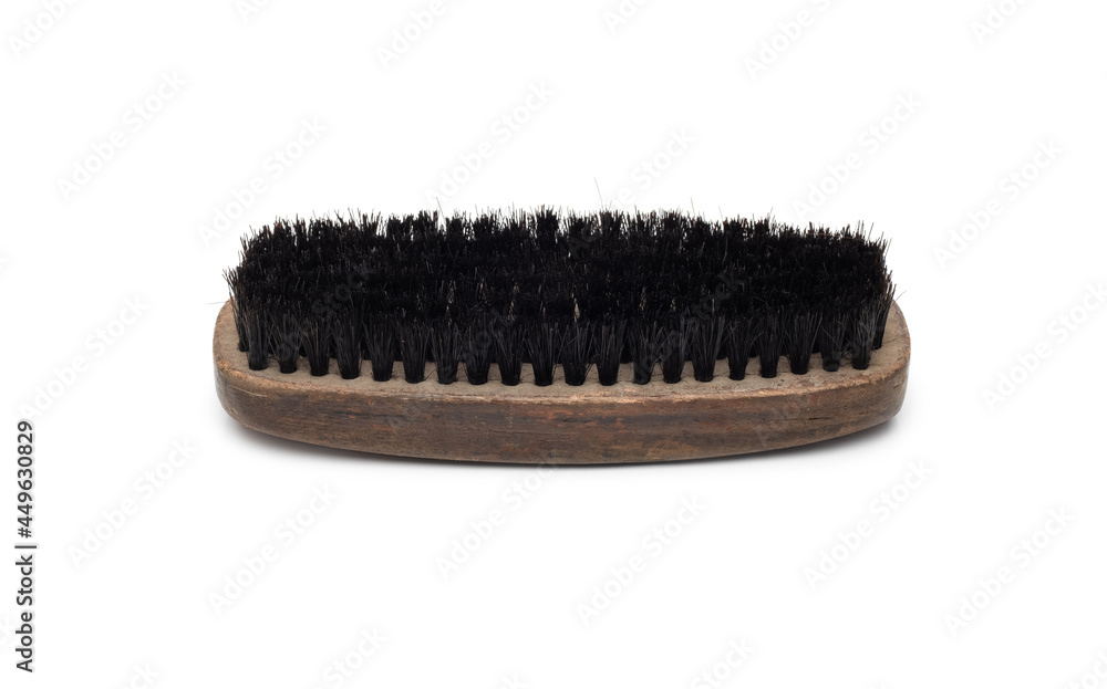 Old wooden shoe cleaning brush on isolated white background Old wooden shoe cleaning brush on isolated white background