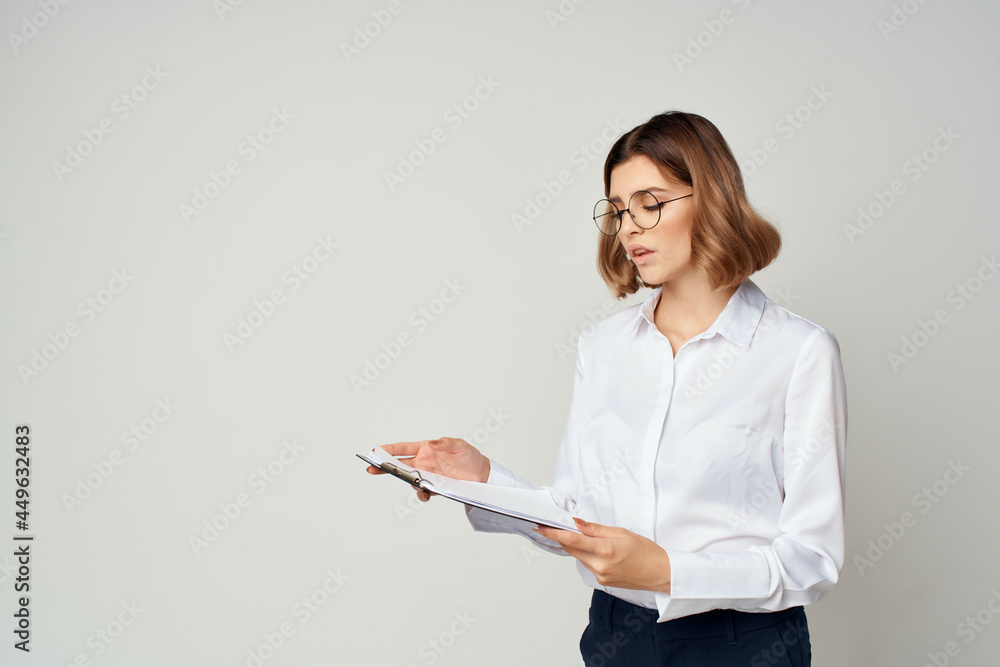 woman in white shirt work documents official professional woman in white shirt work documents official professional