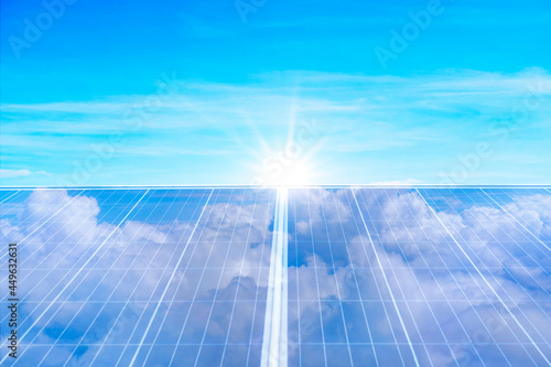 Array Of Solar Panels With Blue Sky And Sunlight Reflection
