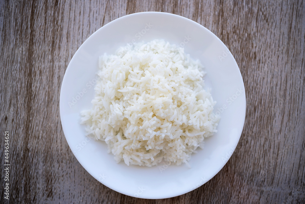 Jasmine rice on the wooden background table Jasmine rice on the wooden background table