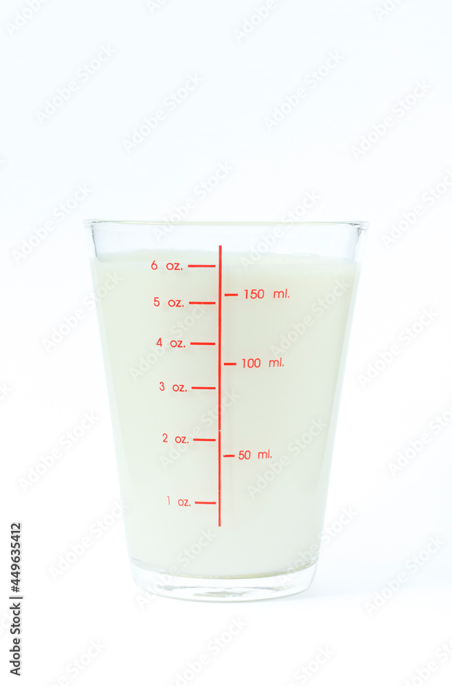 Image of isolated fresh milk in a clear glass containing milligrams for a refreshing drink and a healthy food on a white background with clipping path. Image of isolated fresh milk in a clear glass containing milligrams for a refreshing drink and a healthy food on a white background with clipping path.