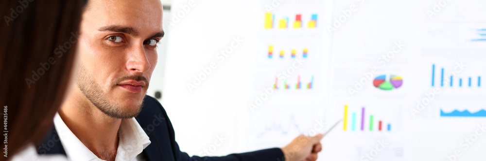 Fototapeta premium Group of people deliberate on white board problem