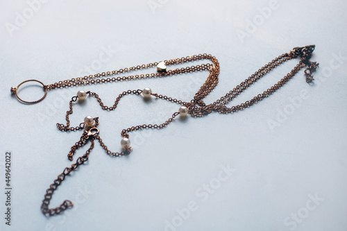 Bilde på lerret cheap jewelry chain bracelet and ring blackened from water on white background