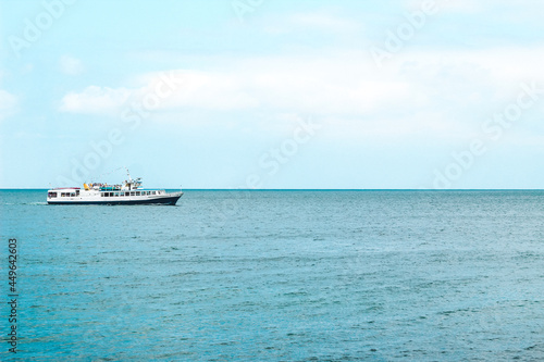 tourist boat sailing here on the blue sea. © ir1ska