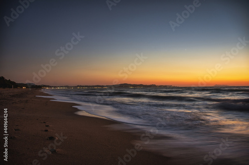 Sunset at a sandy beach on Corfu island - Greece