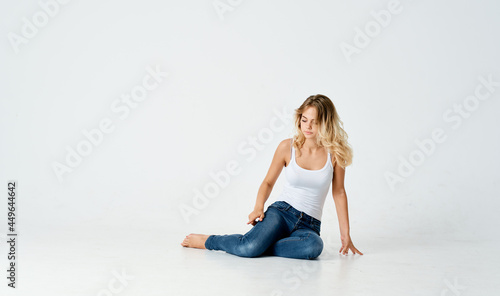 woman sitting on floor barefoot basing lifestyle isolated background