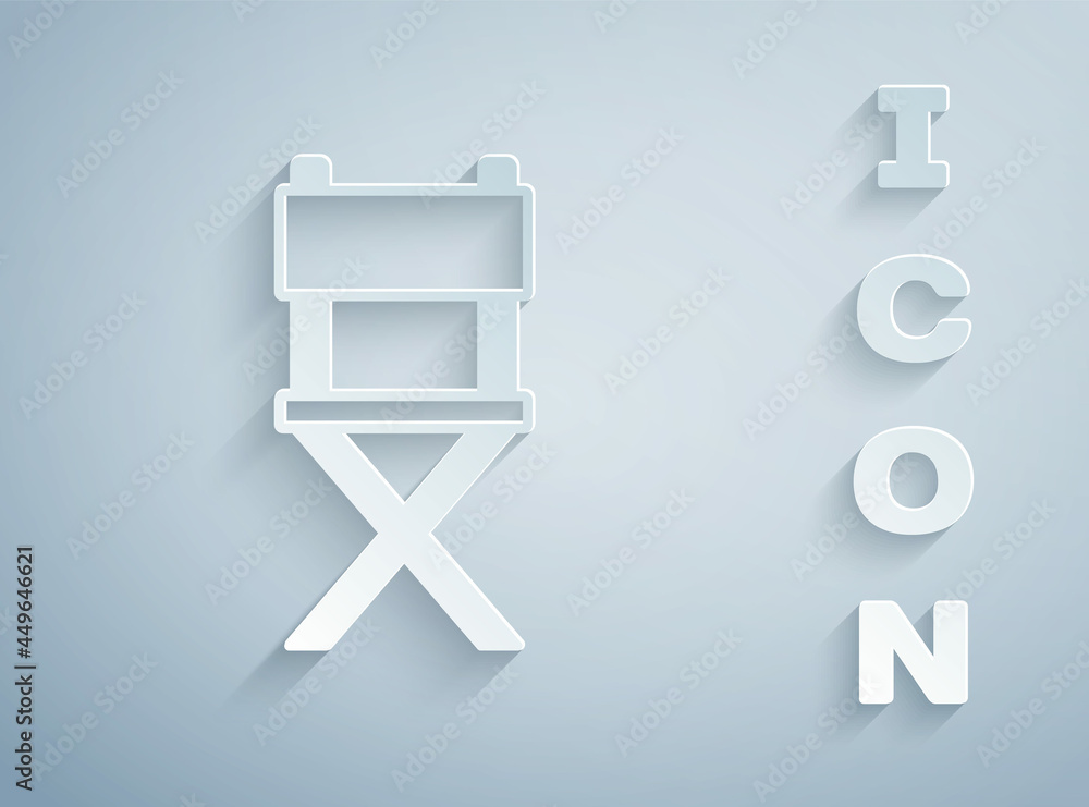 Paper cut Director movie chair icon isolated on grey background. Film industry. Paper art style. Vector Paper cut Director movie chair icon isolated on grey background. Film industry. Paper art style. Vector