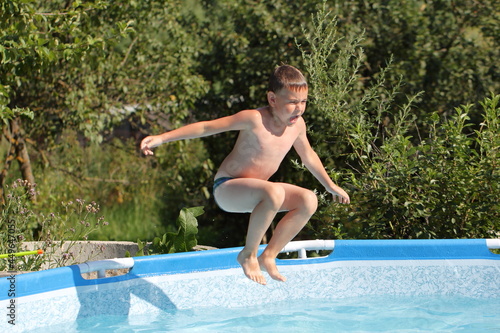 child jumping into the water