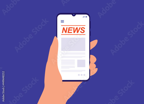 A User's Hand Holding Smartphone With News Mobile App.