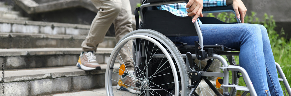 Man tries to drag wheelchair with woman onto stairs Man tries to drag wheelchair with woman onto stairs