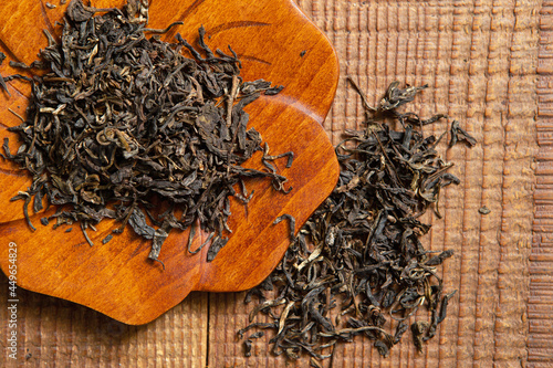 Pu'er tea leaves dried on a bamboo board photo